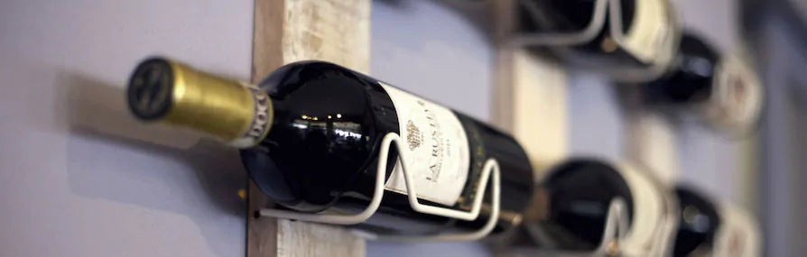 Bottles of wine hanging on a wall